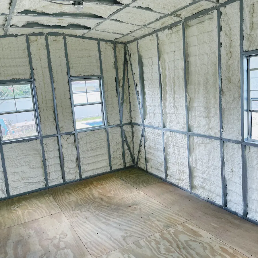 Closed-cell spray foam insulation applied to wall cavities in a residential project in Newark